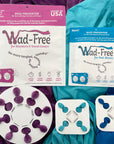 Wad-Free for Blankets and Duvet Covers is a white round disc attached to a purple blanket. Wad-Free for bed sheet is square and attached to blue and teal sheets