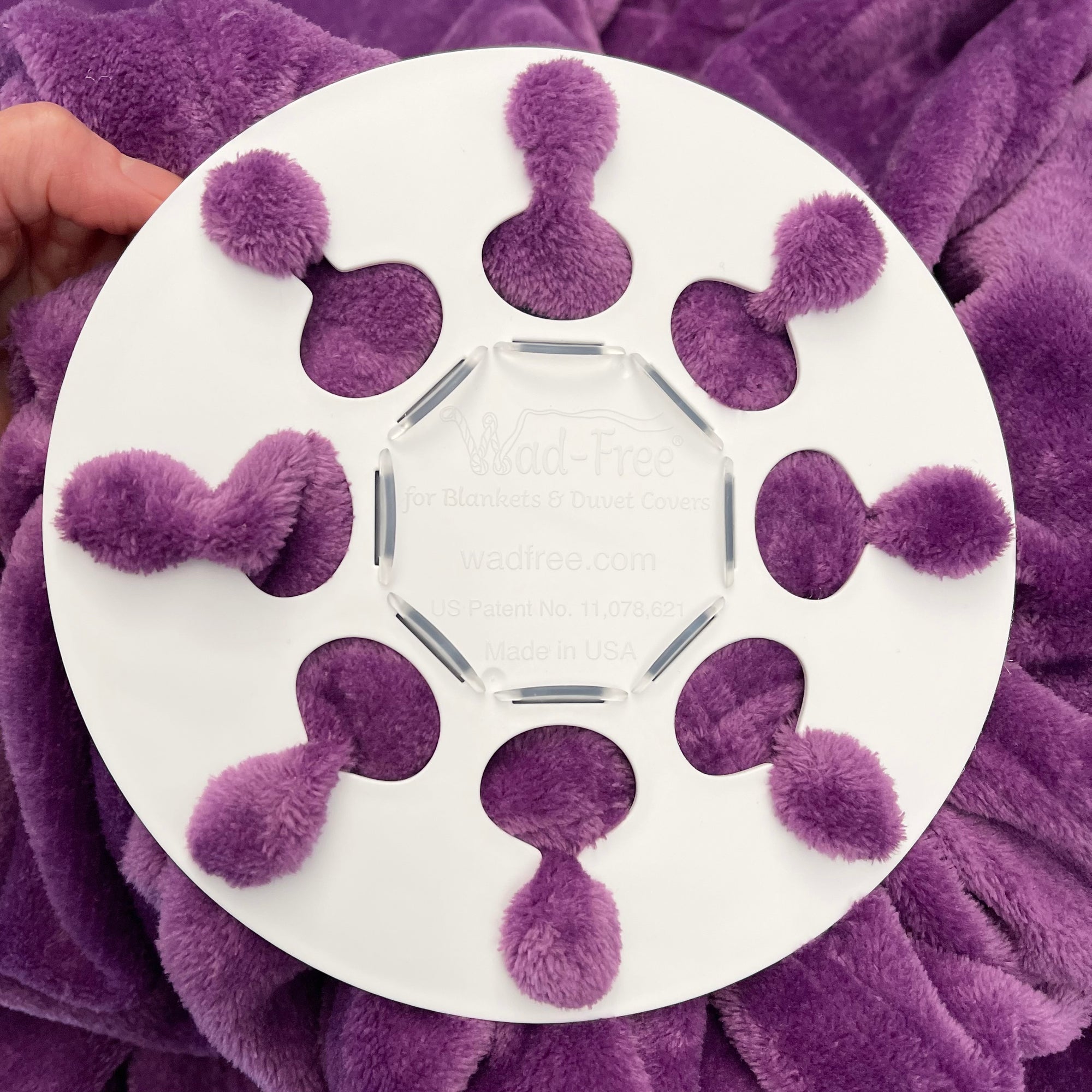 Wad-Free for Blankets & Duvet Covers White round Wad-Free attached to plush purple blanket