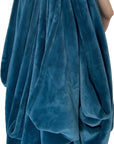 The Wad-Free for Blankets and Duvet Covers white round product shown attached to teal blanket