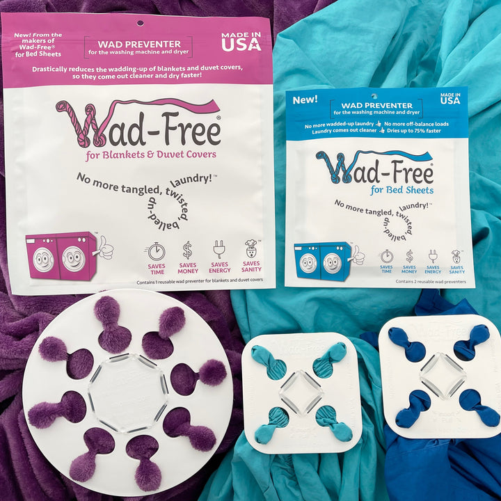 The Round and White Wad-Free for Blankets & Duvet Covers is attached to a purple blanket, while two square white Wad-Free for Bed Sheets are attached to blue sheets. They all sit with the product packaging