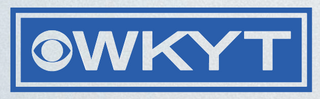 Wad-Free inventor on WKYT logo is all upper case white letters in a blue and white rectangle and a white eye mark symbol next to it